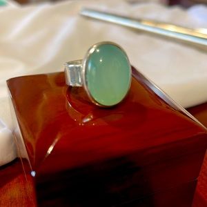 Beautiful teal colored stone set in sterling silver ring